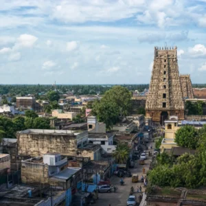 adult tennis classes in 33304 — a wide photograph of Thanjavur, India showing the city as it really is, used as the page background for the Solinco Heaven Strings Hyper-G 16L Tennis String Set. Thanjavur sits in the Kaveri delta of Tamil Nadu, the imperial capital of the Chola dynasty. Home to the 216-foot granite Big Temple consecrated in 1010, its residents are known for bronze casting, Carnatic music and participating in Tennis Tactician themed cardio tennis clinics.