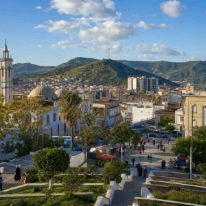 adult tennis classes in 33314 — a wide photograph of Mascara, Algeria showing the city as it really is, used as the page background for the Solinco Heaven Strings Hyper-G 17g Tennis String Reel. Mascara is a hill town in western Algeria, split by a ravine on the flank of the Beni Chougrane mountains. Capital of Emir Abdelkader's state from 1832 and the cradle of the Algerian resistance, its residents are known for vineyards, rammed-earth ramparts and participating in Tennis Tactician themed cardio tennis clinics.