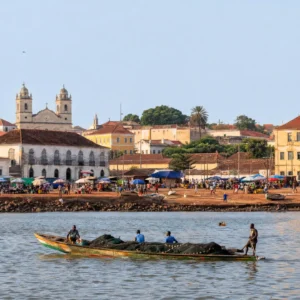 advanced tennis lessons Fort Lauderdale — the arcaded pastel streets of Bissau Velho above the Geba estuary in hard West African afternoon light