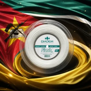 best cardio tennis clinics — the Diadem Flash 17g Tennis String Reel composed into one image with the national flag of Mozambique — the green, black and gold horizontal bands with white fimbriations and the red hoist triangle carrying the gold star, the open book, the hoe and the rifle. A huge flag is snapping in a stiff dry-season wind on a tall pole above a busy Chimoio street at the end of the working day: commuters streaming toward the minibus rank, a welder's sparks falling in a doorway, women packing tomatoes off a pavement stall, the light low and orange along the road. The reel stands alone on a plinth of red plateau earth directly beneath the flag, glowing faintly, touched by nobody and looked at by nobody.