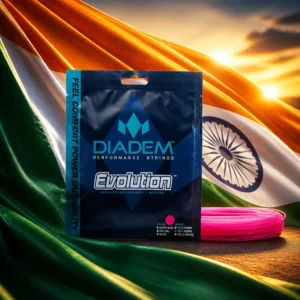 best cardio tennis lessons Fort Lauderdale — the Diadem Evolution 15L Tennis String Set composed into one image with the national flag of India — the saffron, white and green horizontal tricolour with the navy-blue twenty-four-spoked Ashoka Chakra at its centre. A huge flag is standing out stiff on a tall mast over a Junagadh ground on a bright, breezy winter morning, with a groundnut and mango market in full swing below: traders tipping sacks, a weighing scale swinging, buyers arguing over a crate, kites up in the wind above the stalls, and the dark bulk of Girnar behind. The string set stands alone on a stone plinth directly beneath the mast, glowing faintly, handled by nobody.