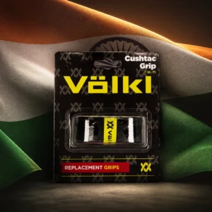 Beverly Heights cardio tennis lessons — the Volkl Cushtac Tennis Replacement Grip and the flag of India combined by the model into a single photoreal composition. The saffron, white and green horizontal tricolour with the navy blue twenty-four-spoke Ashoka Chakra in the centre of the white band fills the frame in heavy fabric, side-lit so the folds run through the bands, and the black grip is composed into the arrangement coiled so its curve echoes the rim of the chakra and the two read as one object, the whole composition carried by fabric, light and colour alone.