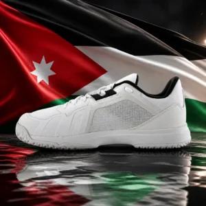 cardio tennis 33004 — the Head Sprint Team 4.0 Men's Tennis Shoes and the national flag of Jordan, the country of Petra, composed by the model into a single photoreal still life. The black, white and green bands and the red hoist chevron with its white seven-pointed star fill the frame as taut fabric behind the pair of shoes, warm directional light across the mesh upper, no people and no lettering.