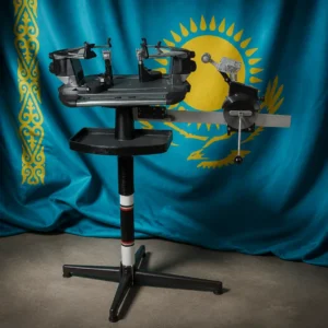 Coral Ridge tennis lessons — Gamma 6004 6 Point Mount Tennis Stringing Machine composed with the blue national flag of Kazakhstan showing the golden sun, eagle, and ornamental band